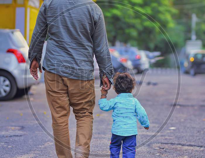 Father and Son walking roadside