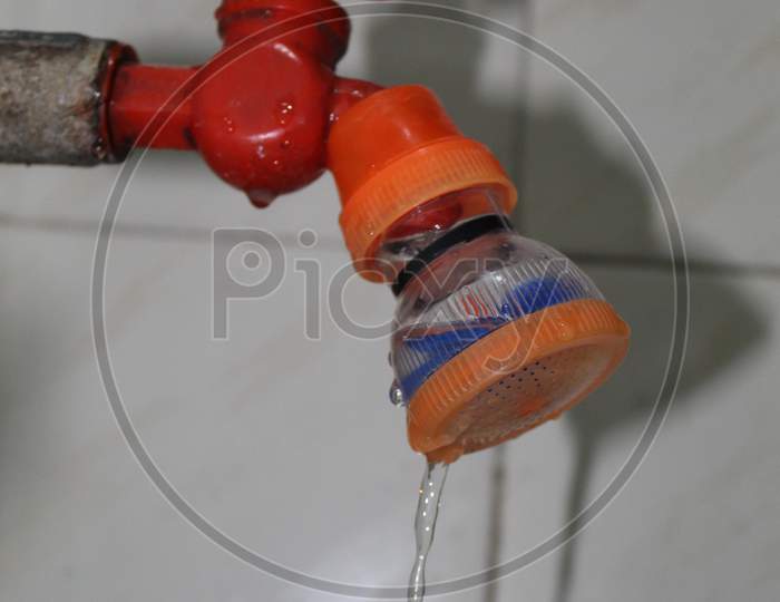 A Water Tap with Water Filter (Water strainer).