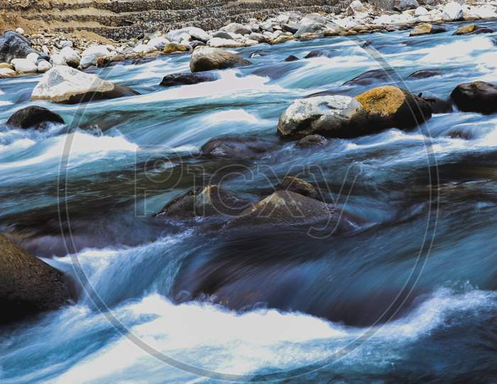 Long Exposure Of Fast Flowing River