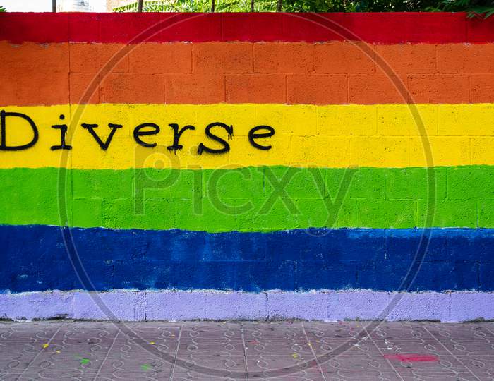 Wall With The Colors Of The Lgbt Flag And The Word Diverse Written On It