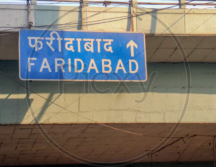 "New Delhi /India -12.06.2020: Roads Sign  Street  in Faridabad in New Delhi  Written  English and Hindi "