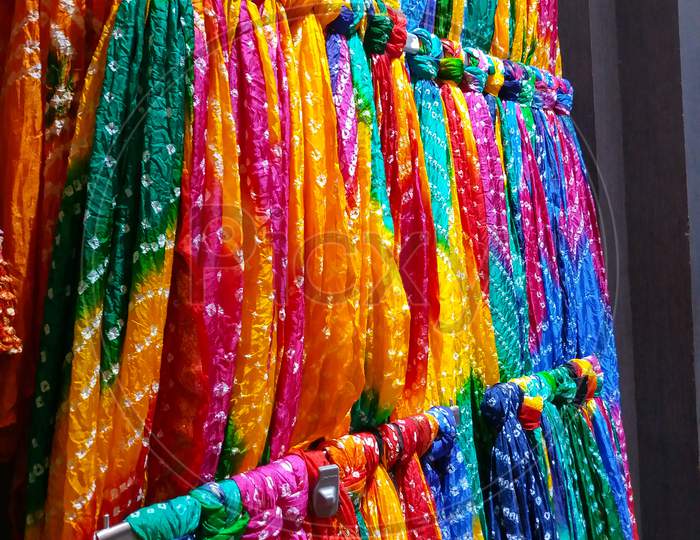 colourful dupattas,scarves hanging in the street markets of india.