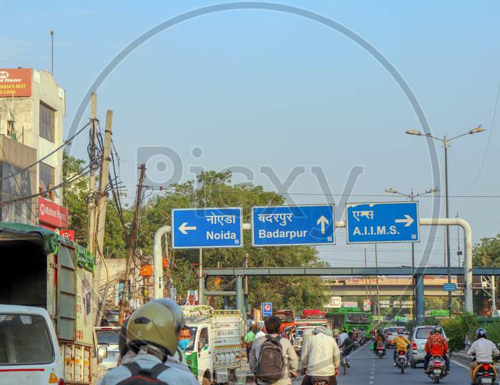 "New Delhi/India  -12.06.2020:Road direction Sign  board at   Noida , A.I.I.M.S and Badarpur Written  in Hindi And English Languages
