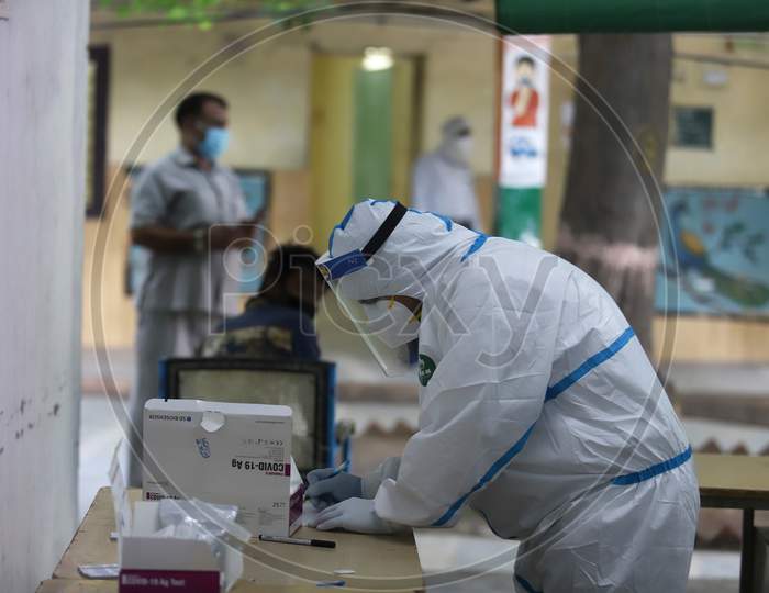 A Medical Professional Notes Details Of Swab Samples Collected To Test For Covid-19 Infection On June 22, 2020 In New Delhi, India.