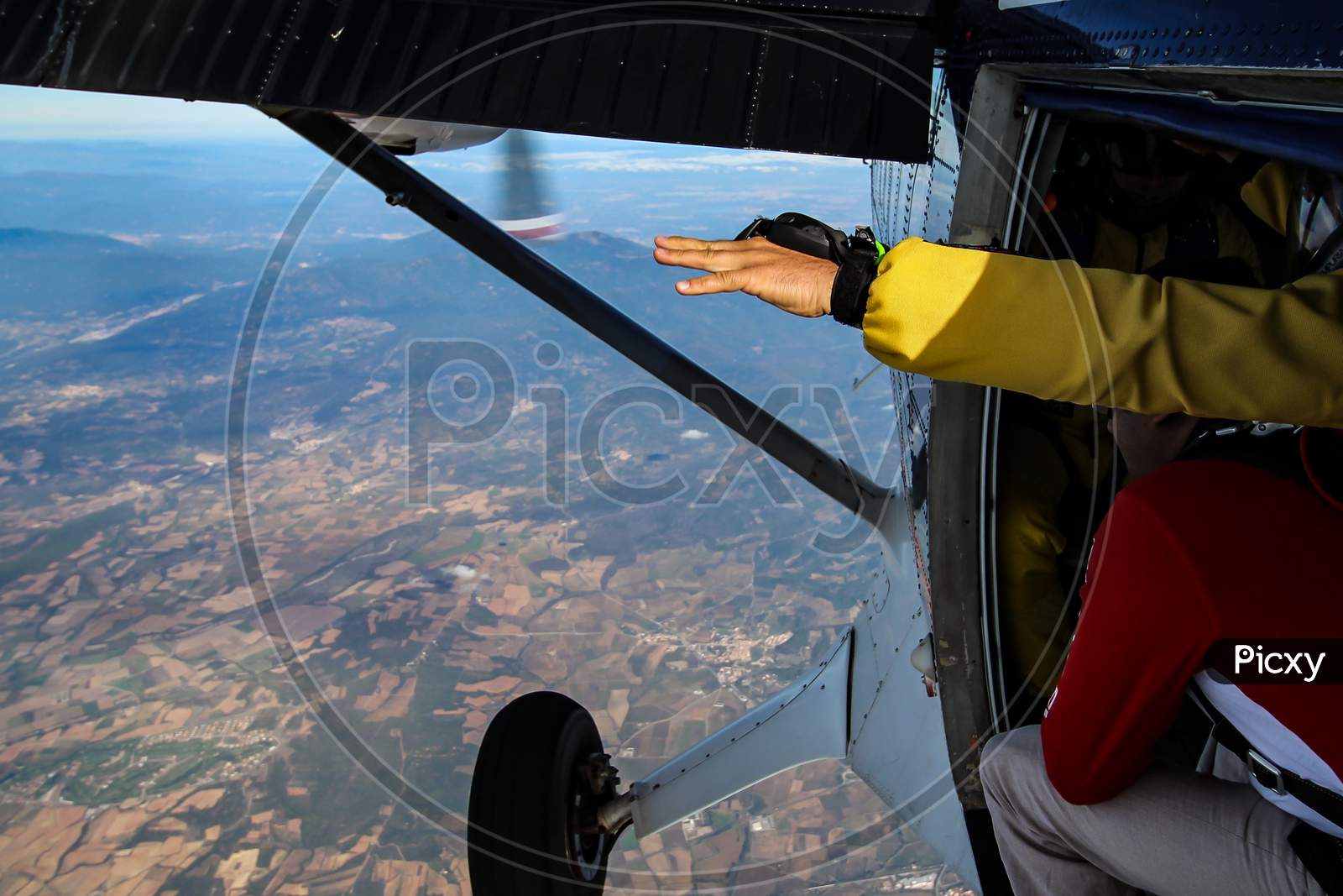Man Poses For Skydiving In Plane Before Jump.