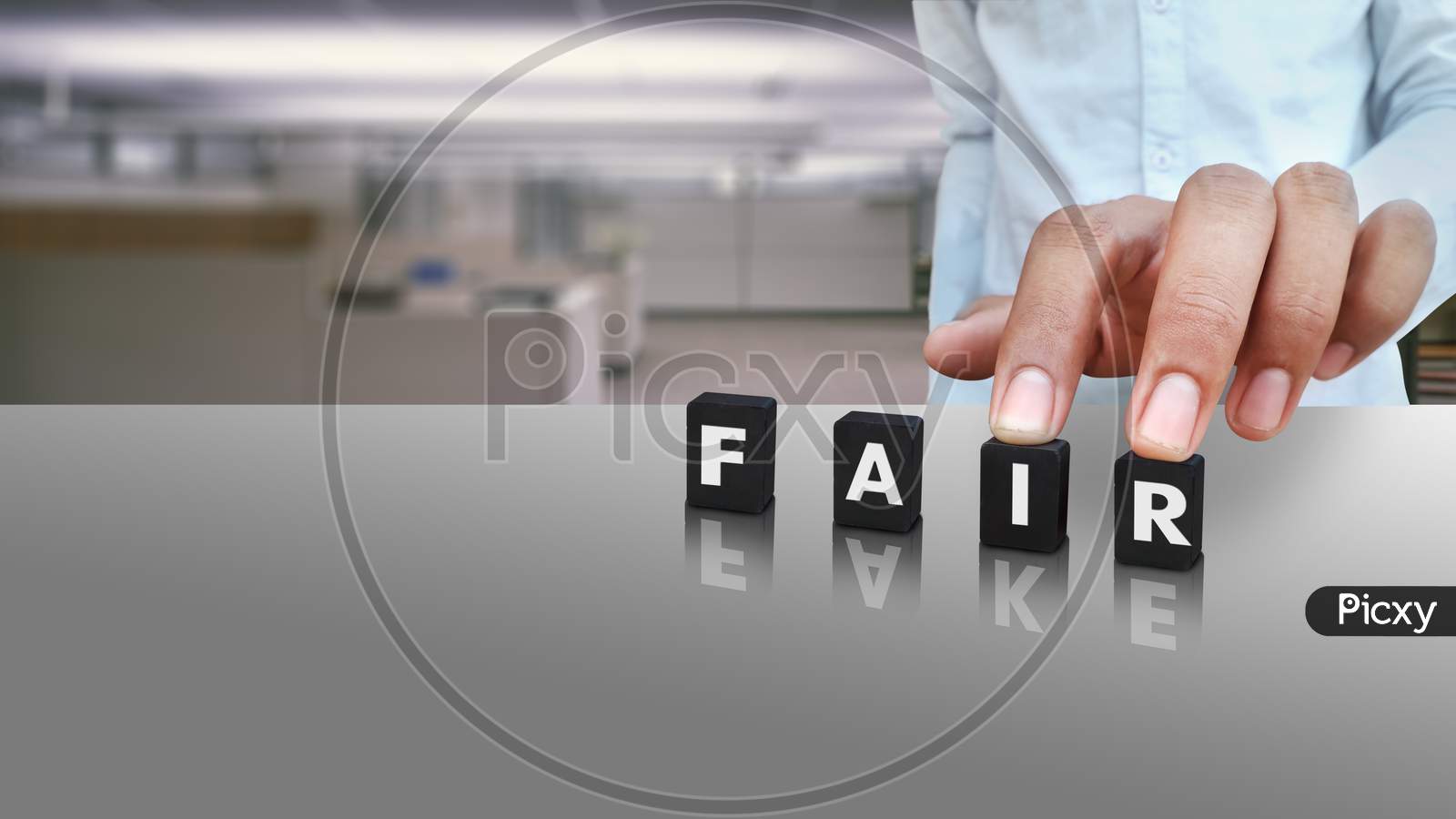 A Male Person Putting Cubes Labeled With Fair Text And Fake In Reflection Conceptual Image On Social Media Day