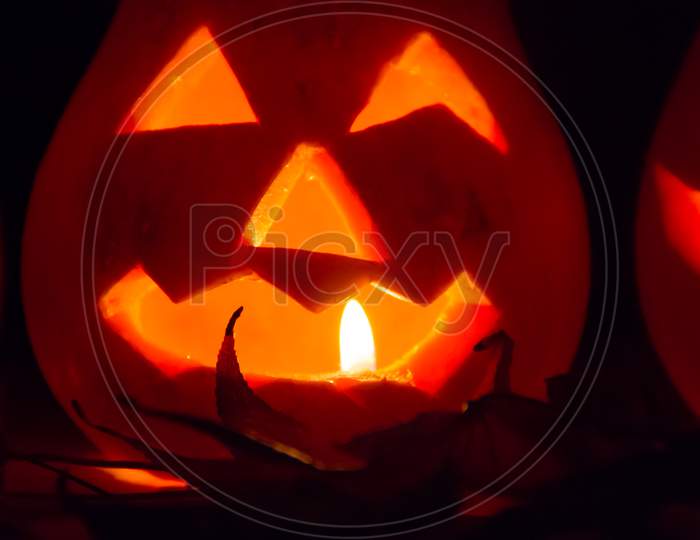 Halloween Candles And Pumpkins In The Dark