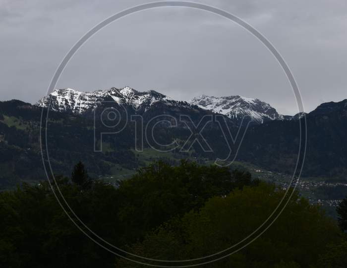 Image of Liechtenstein mountains on a dark an rainy day seen from ...