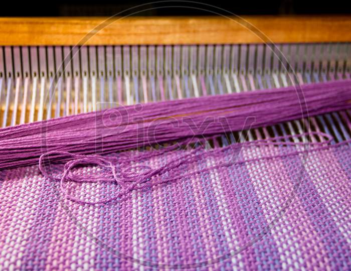 Detail Of Fabric In Comb Loom With Ultraviolet And Lilac Colors