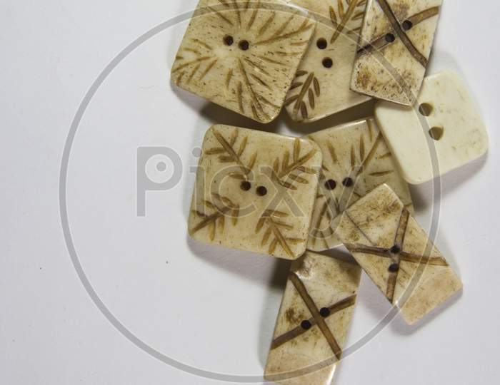 Buttons Sewing Industry Textile Brown And White Colors On White Background