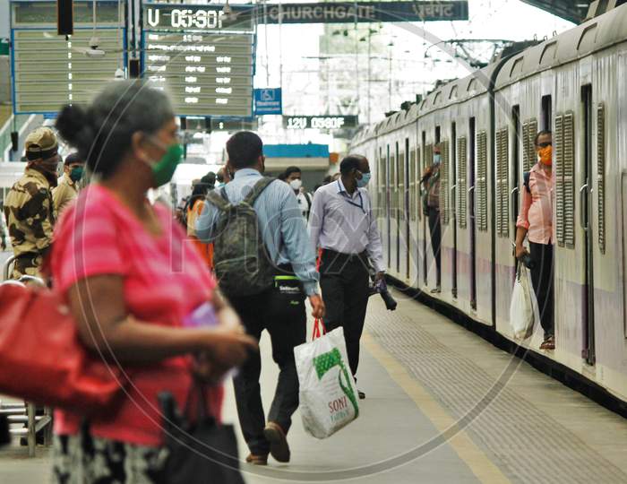 A train carrying essential service workers arrives at a platform, after the government eased a nationwide lockdown that was imposed as a preventive measure against the COVID-19 coronavirus, at Churchgate station, in Mumbai, India, on June 16, 2020.