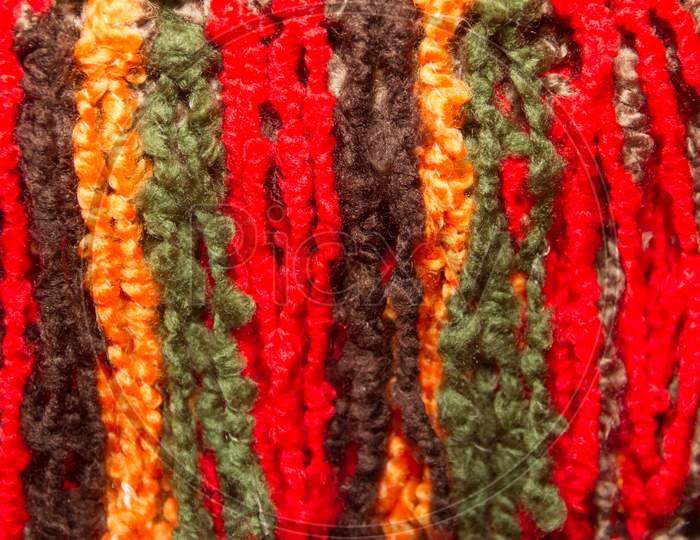 Texture Of Wool Fringes And Colored Threads