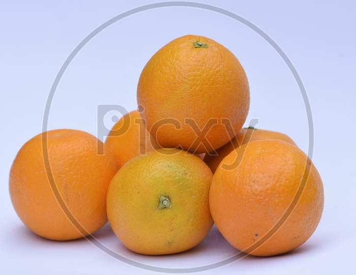 Mandarin Fruit Heap On White Background. Fresh Fruits From India Asia