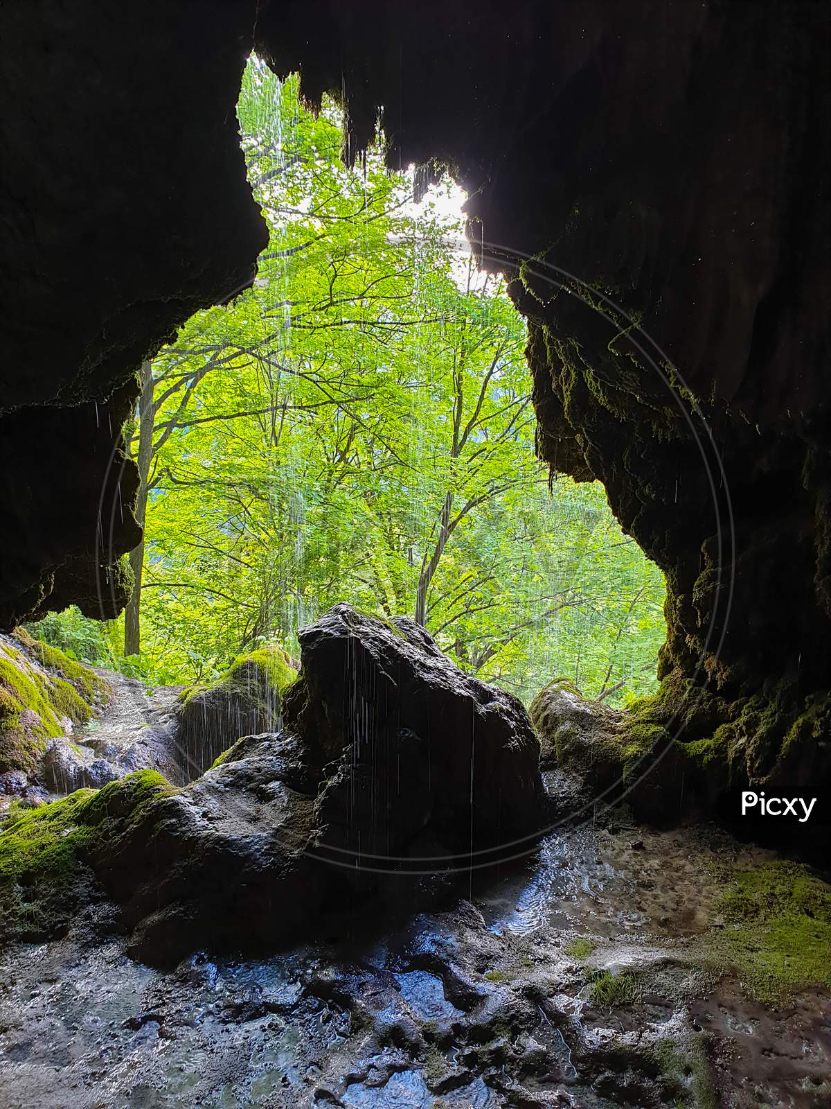 Cave Entrance At Pietrele Vorbitoare Waterfalls