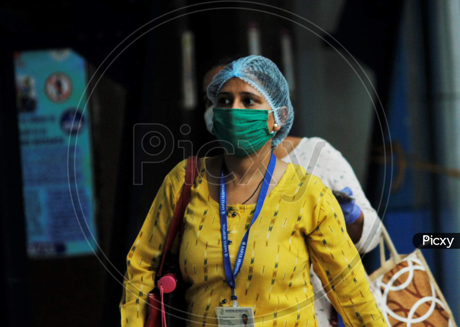 A commuter walks on a platform as she arrives to board a train scheduled for essential service workers, after the government eased a nationwide lockdown that was imposed as a preventive measure against the COVID-19 coronavirus, at Churchgate station, in Mumbai, India, on June 16, 2020.