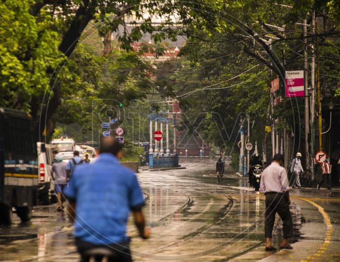 People are walking on road  while raining in kolkata near Lalbazar Police Headquarters on 21st June 2020 at Kolkata, West Bengal, India