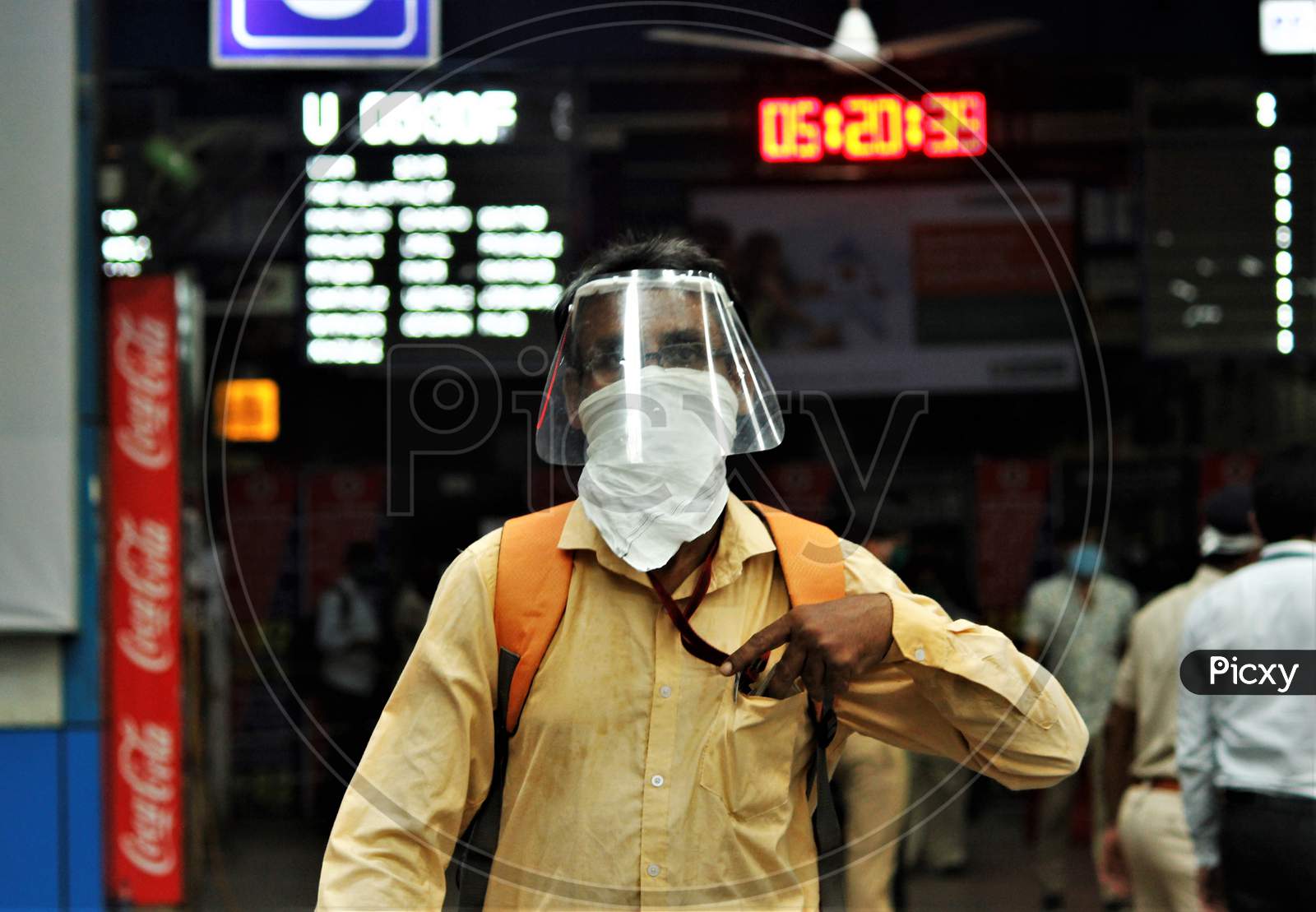 A commuter walks on a platform as he arrive to board trains scheduled for essential service workers after the government eased a nationwide lockdown that was imposed as a preventive measure against the COVID-19 coronavirus, at Churchgate station, in Mumbai, India, on June 16, 2020.
