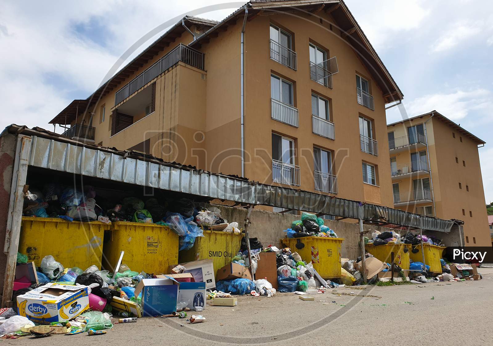 Filled Trash Bins In Populated Area In Floresti