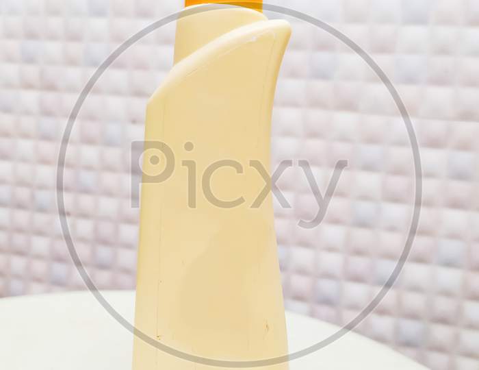 skin care moisturiser oil bottle in clean and white surface and in blurred background
