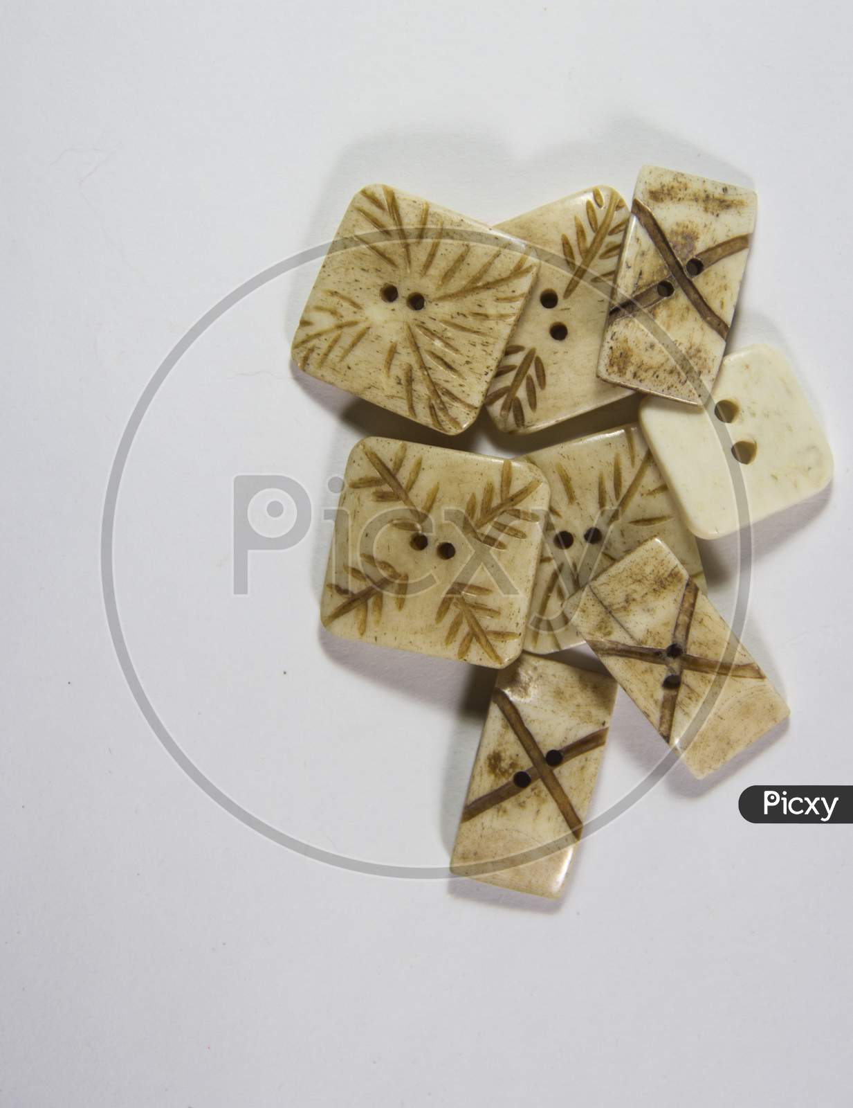 Buttons Sewing Industry Textile Brown And White Colors On White Background