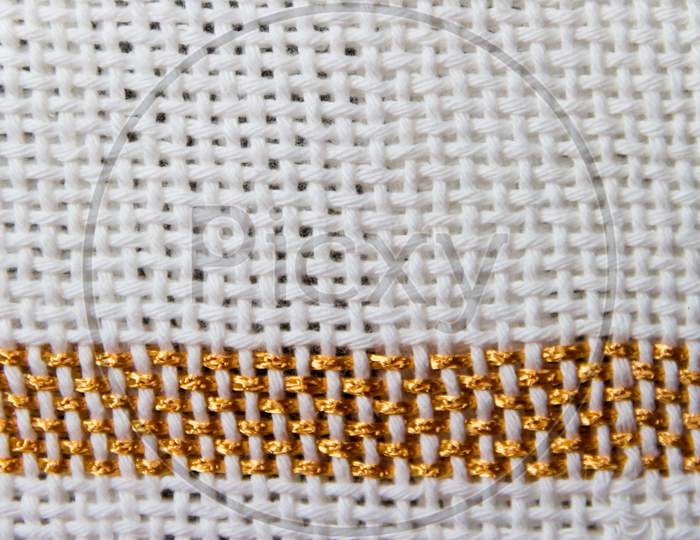 Textures Of Loom-Woven Threads In White Tones With Golden Edges