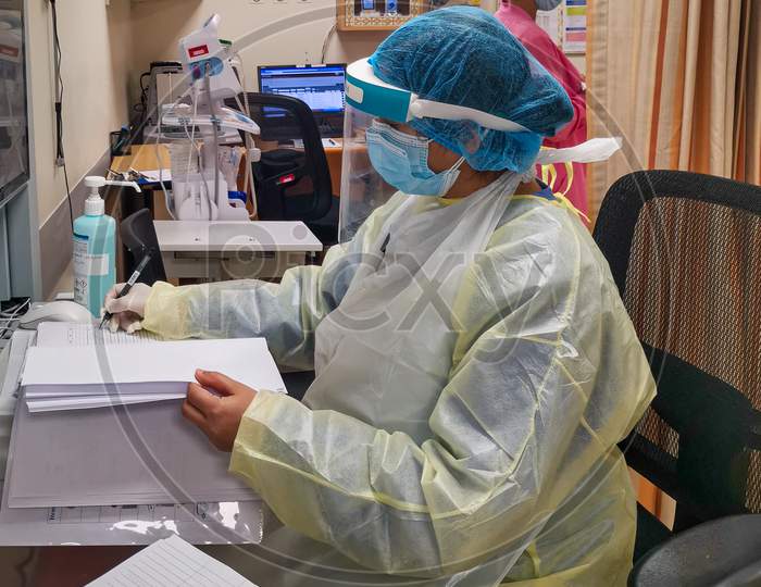Female nurse wearing Personal protective equipment (PPE) in the hospital to fight against Coronavirus disease (COVID-19)
