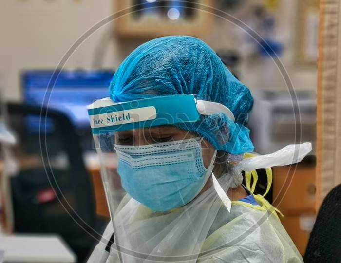 Female nurse wearing Personal protective equipment (PPE) in the hospital to fight against Coronavirus disease (COVID-19)