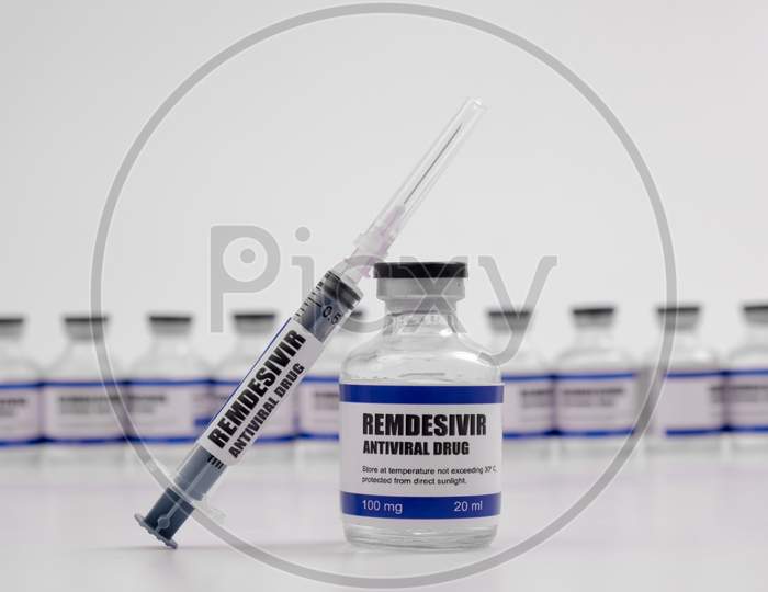 Remdesivir Antiviral Injectable Drug Vaccine Medicine Vial Covid-19 Corona Virus 2019-Ncov Syringe Injection. Vaccination, Immunization, Treatment To Cure Covid 19 Corona Virus Disease Medical Concept