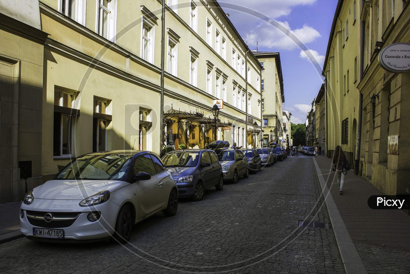 Krakow, Poland - May 23, 2014: Car Parking And European Architecture Street View