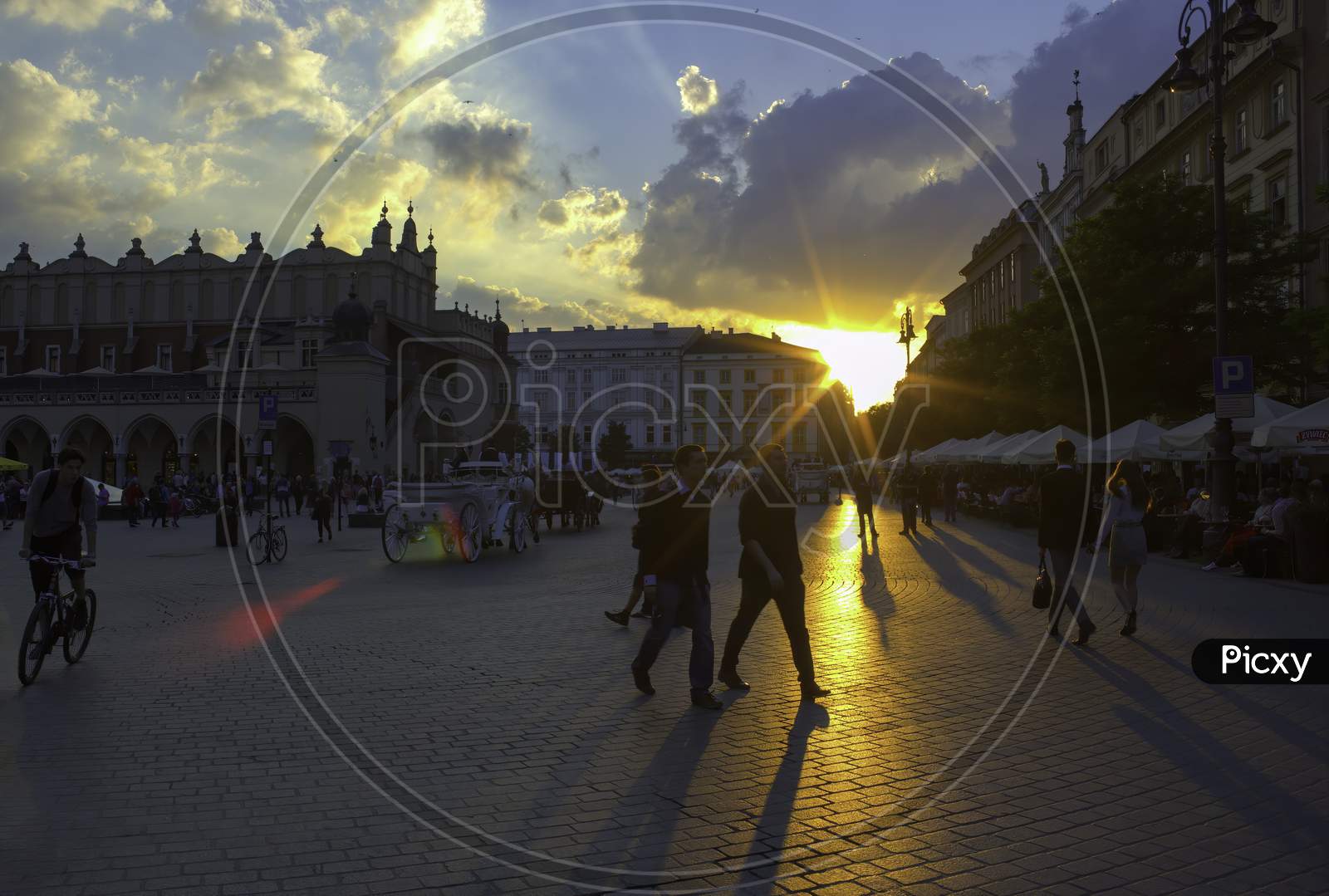 Krakow, Poland - May 23, 2014: A Wide Angle Street View Of Touristic Main Square At The Center Of Krakow City In Poland
