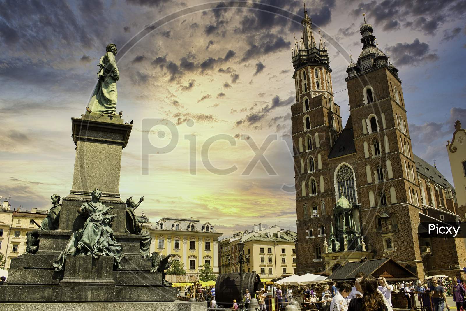 European Monuments Opposite St. Mary'S Basilica Gothic Church Against Dramatic Sunset Located In Krakow City, Poland, Europe