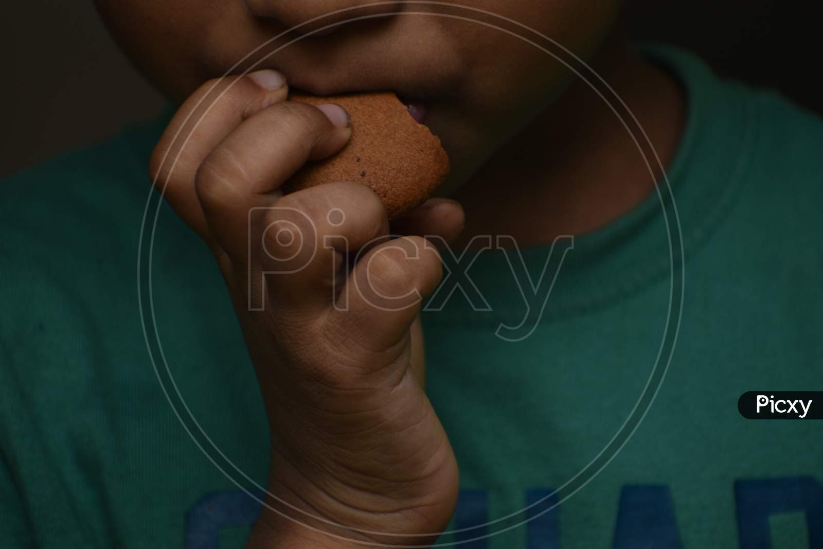 child eating delicious chocolate cookies.