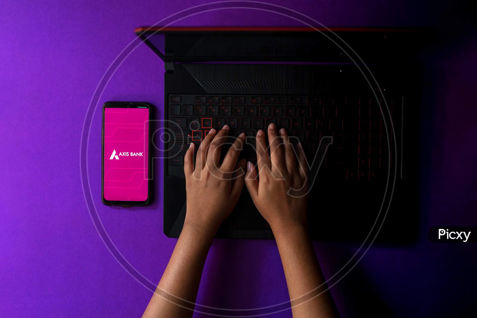 Axis Bank app displayed on a smartphone while working from home