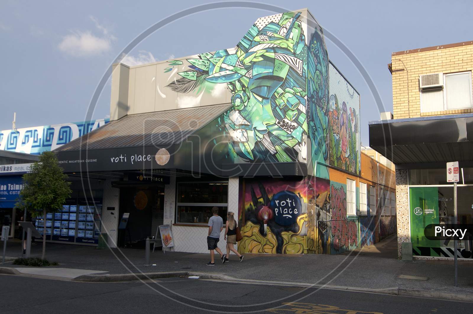 Beautiful Street View Of Boundary St. And Mural On A Building