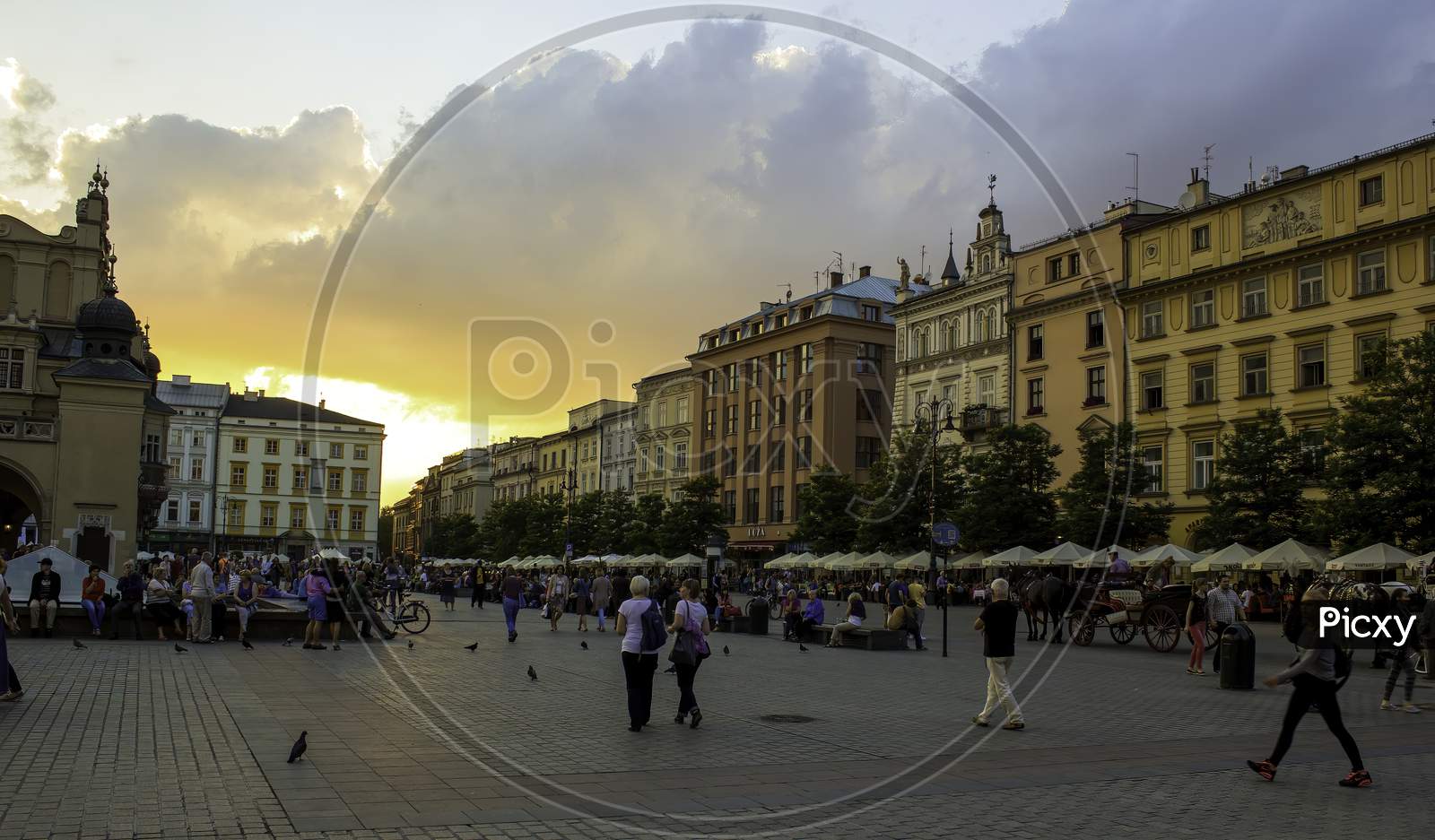 Krakow, Poland - May 23, 2014: A Street View Of Touristic Main Square At Sunset In The Center Of Krakow City In Poland