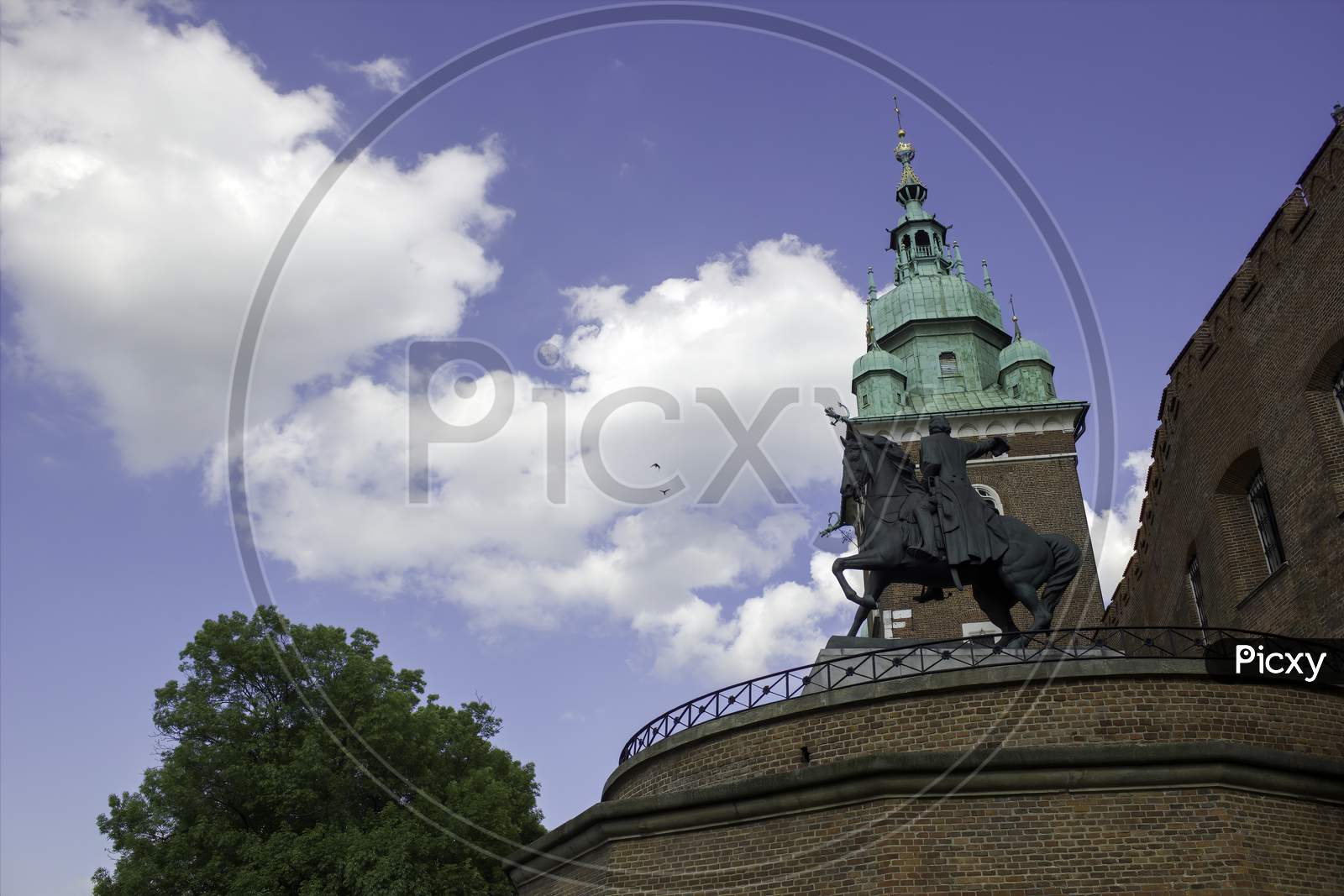 A Monument In Wawel Castle Tower Against A Blue Sky Located In Krakow City In South Poland, Europe