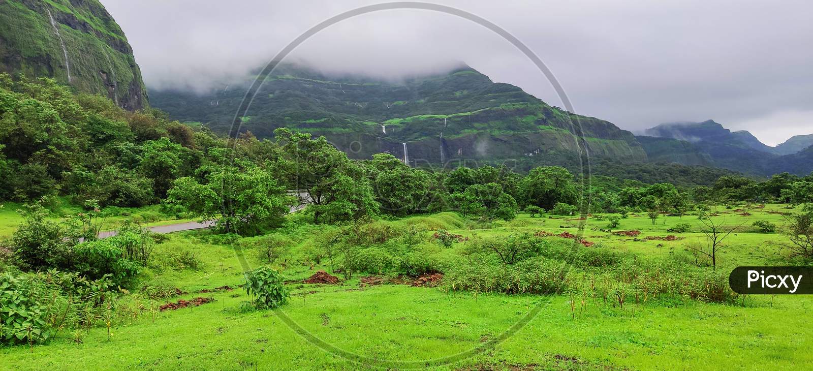 Waterfalls Flowing From Scenic Western Ghats Mountains Of Tamhini Near Pune Maharashtra During Monsoon Season