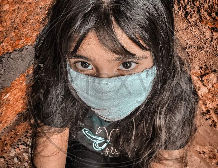 Small girl wearing mask
