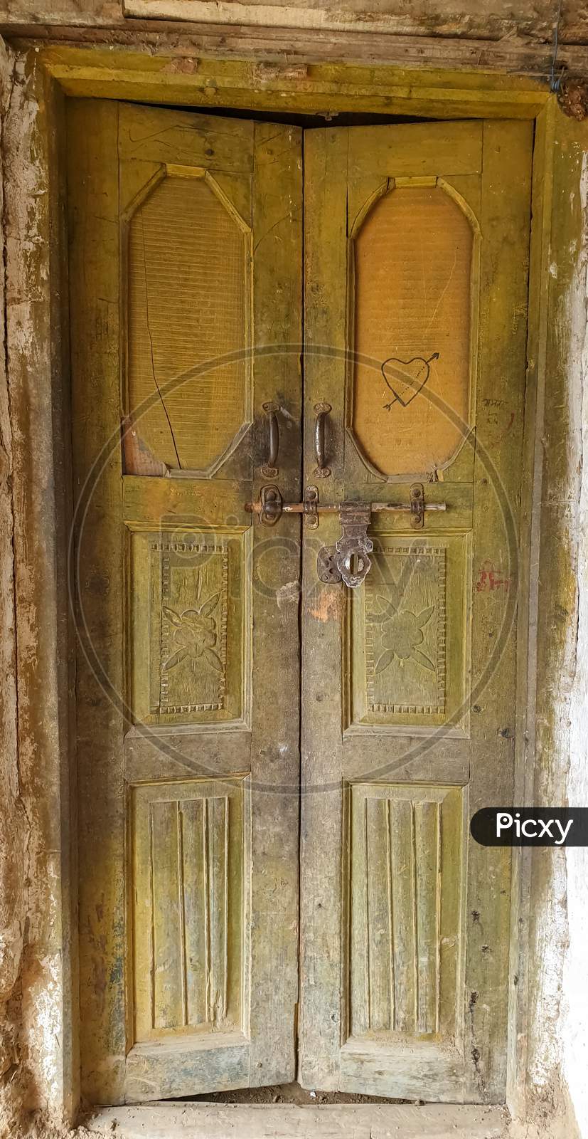 Photo of wooden door of old Indian house in hilly area of Himachal Pradesh, India