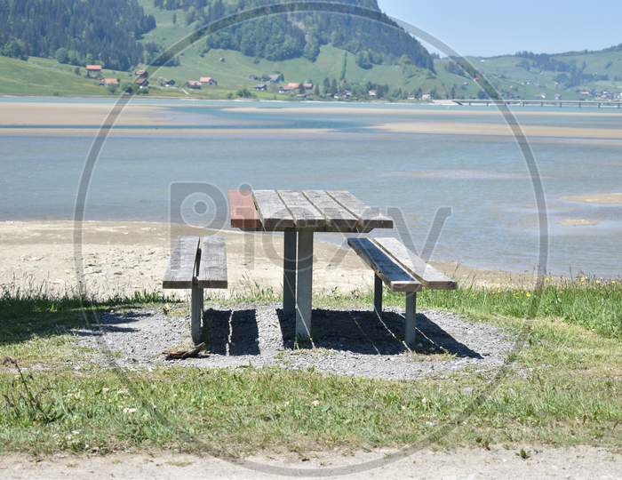 Empty bench at the Sihlsee in Switzerland during corona crisis 18.5.2020