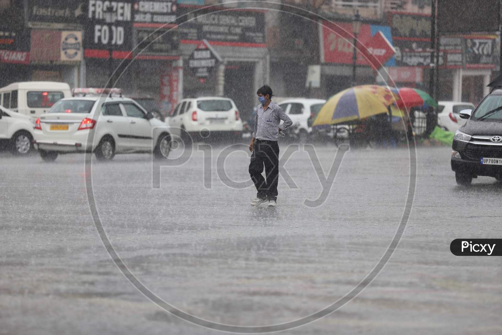A Man Walks On The Road During Heavy Monsoon Rain In Prayagraj, June 25, 2020.
