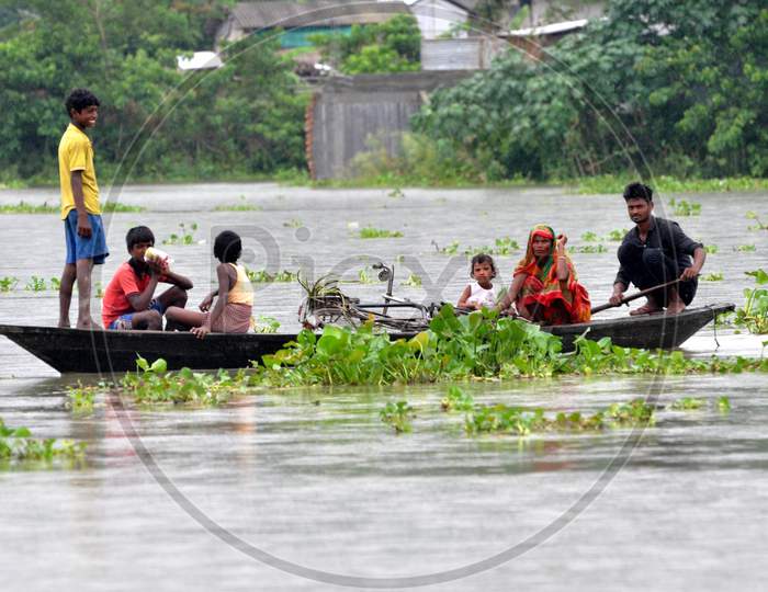 Flood Affected Villagers On Their Way To The Shelters In Morigaon District Of Assam On June 25,2020.