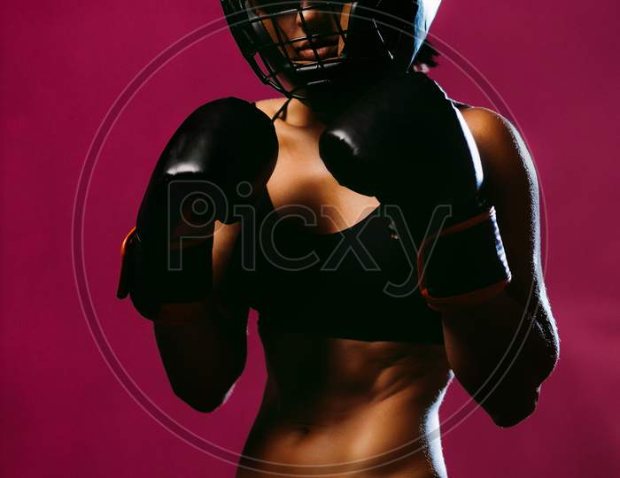 Sexy Woman Fighter In Boxing Gloves And Headgear Protective