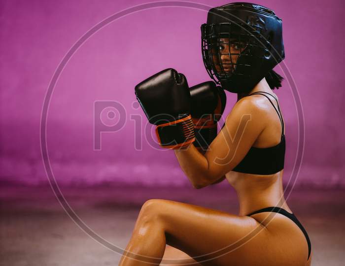 Beautiful Woman Fighter In Boxing Gloves Posing