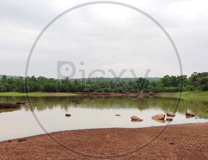 Lake View In Monsoon Countryside Area Under Clear Sky