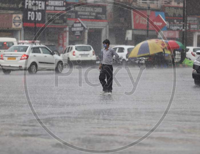 A Man Walks On The Road During Heavy Monsoon Rain In Prayagraj, June 25, 2020.