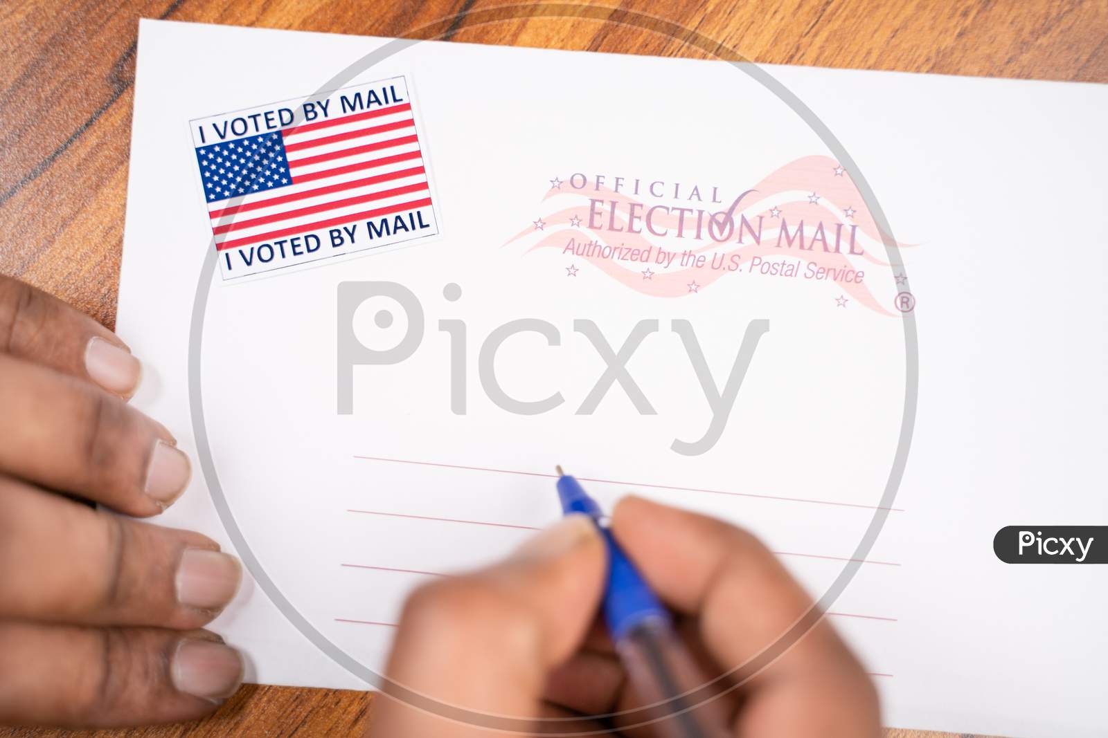 Maski, India - 23, June 2020 : Hands Filling Out Mail Postel Stamp, Concept Of Voted By Mail During Us Election.