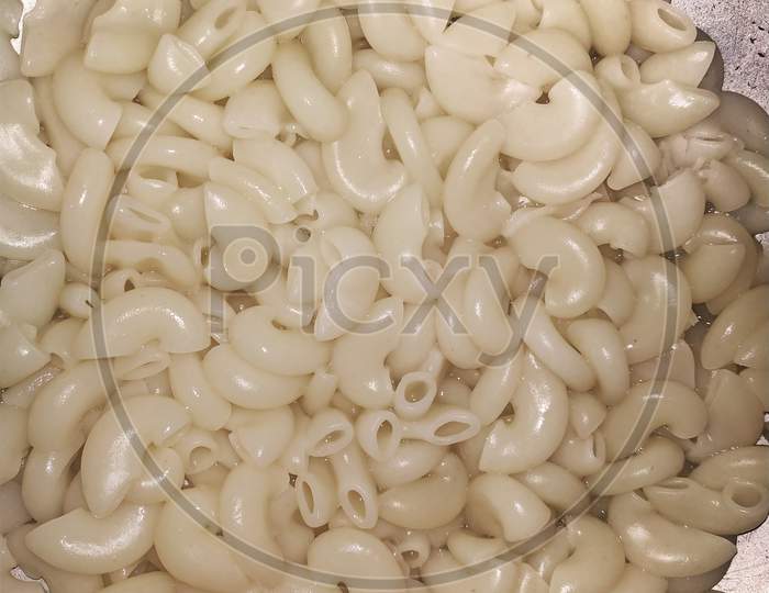 Full Background Of Boiled Uncooked Macaroni Pasta. This Photo Is Taken In India By Vishal Singh .