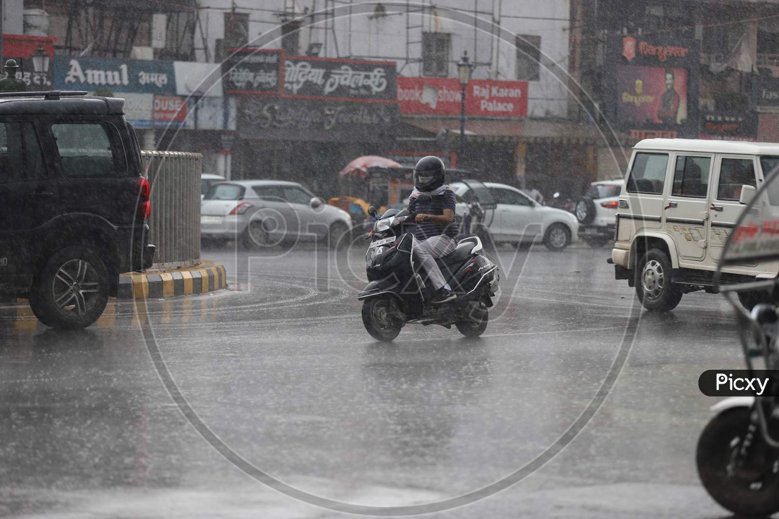 A Man Rides Scooty On The Road During Heavy Monsoon Rain In Prayagraj, June 25, 2020