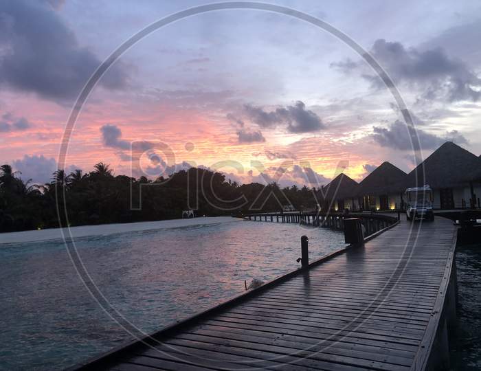 Sunset water villa in Maldives